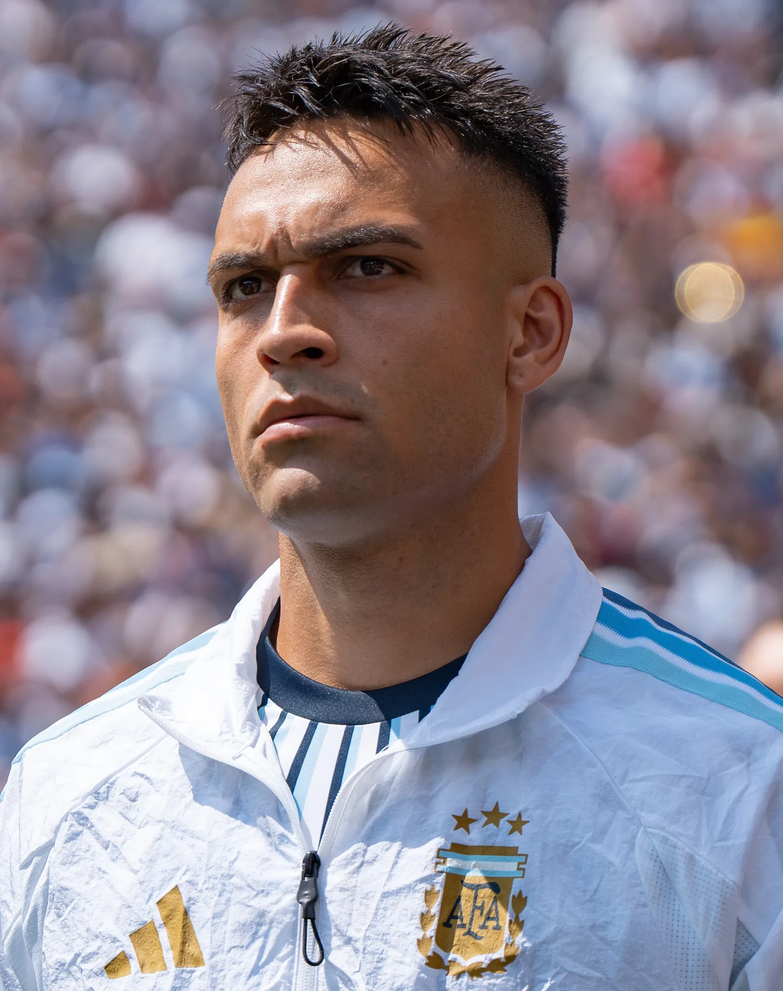 Close portrait of Lautaro Martinez in an Argentina jacket during the 2026 World Cup final against Spain.