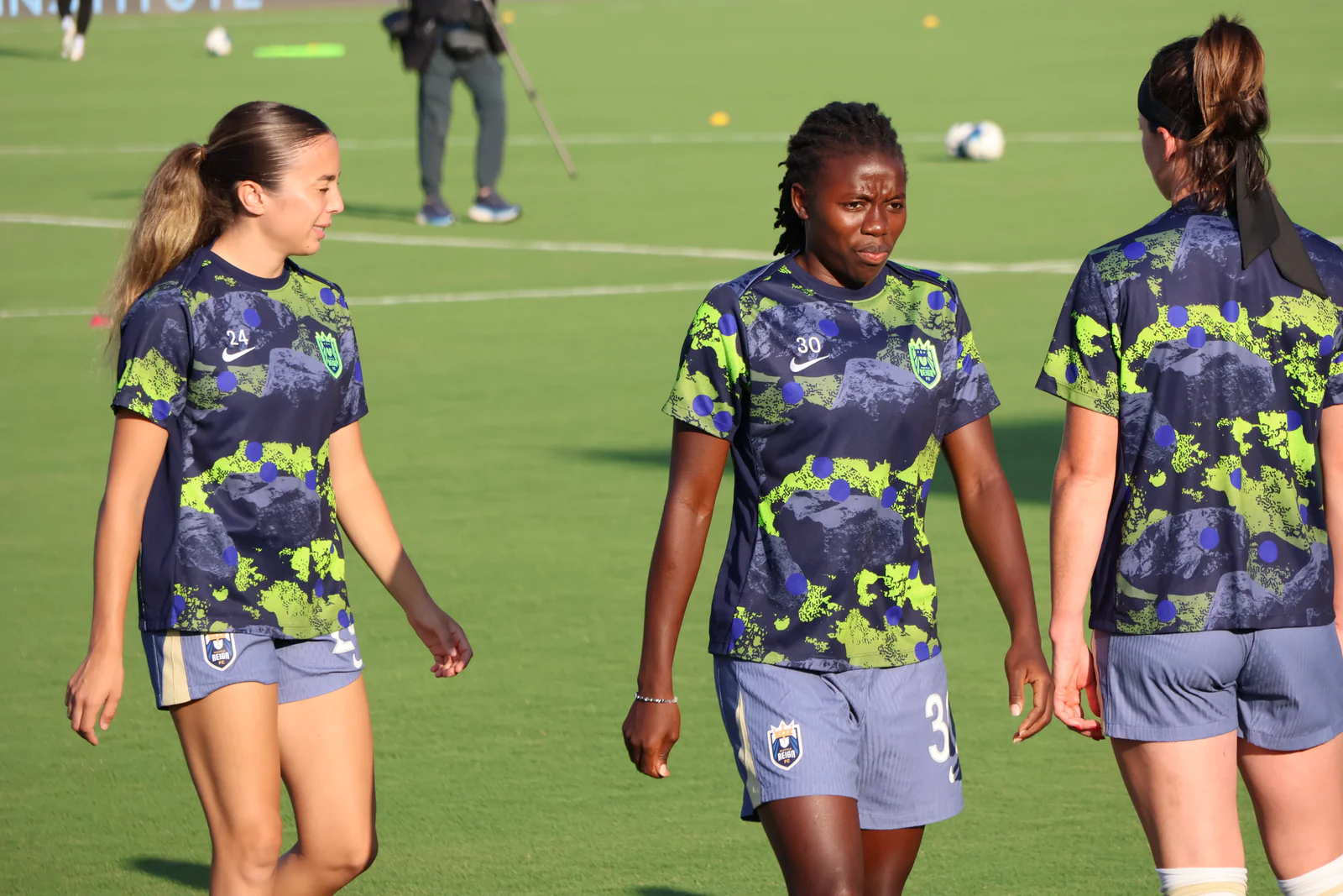 Nérilia Mondésir in Seattle Reign training gear on a football field before North Carolina Courage v Seattle Reign.